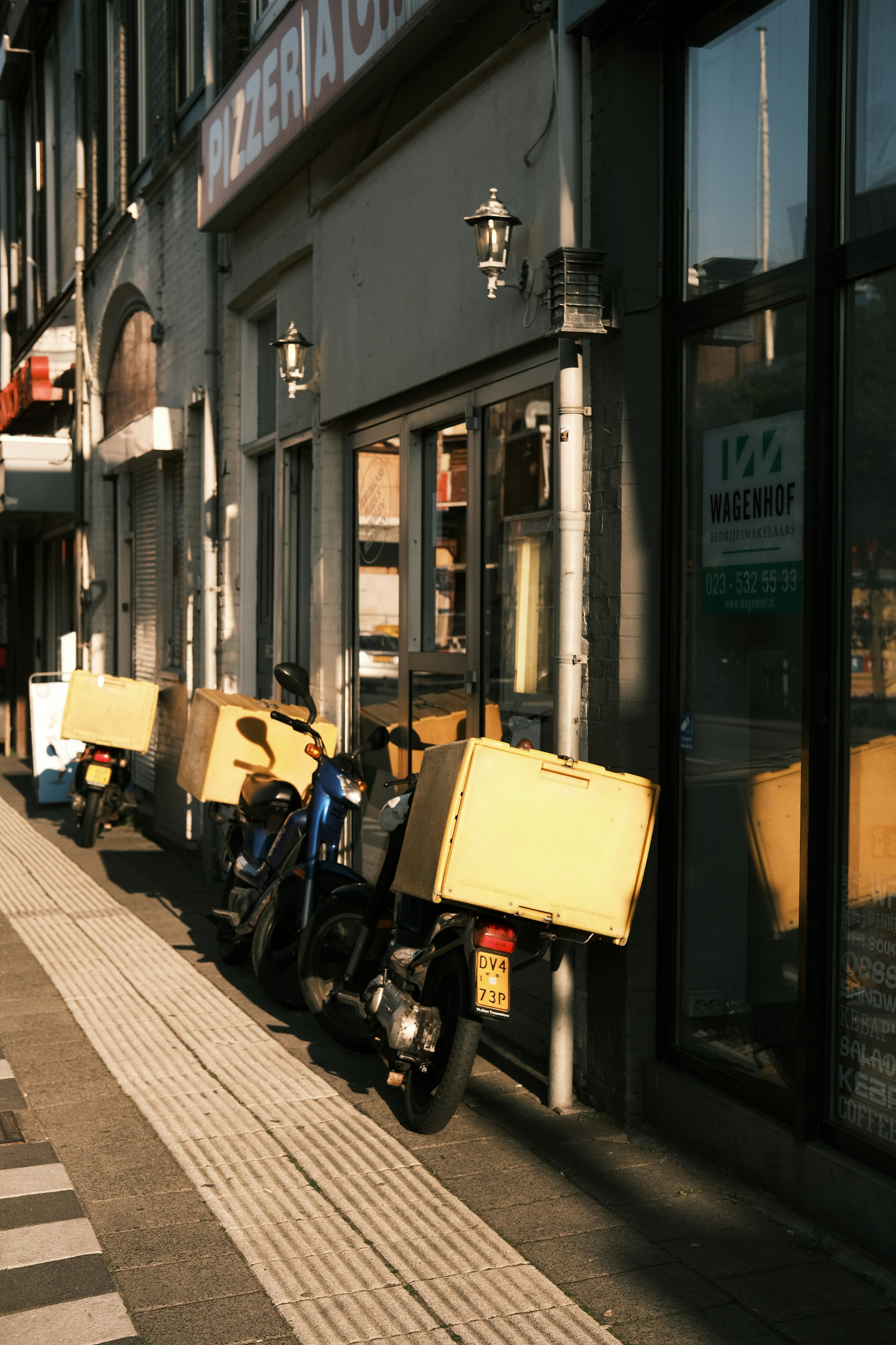 yellow and black motorcycle parked beside black motorcycle